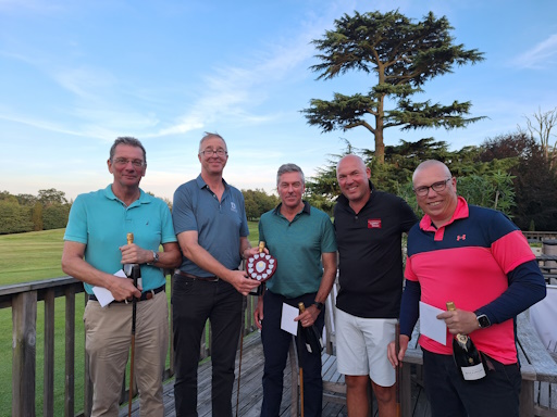 Ingleton Wood’s Managing Partner David Cresswell celebrates with the winners of the 2023 Charity Golf Day. 