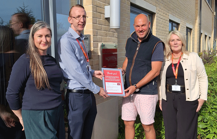 Ingleton Wood being presented the Total Clean certificate
